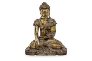 A THAI STATUE OF BUDDHA SITTING