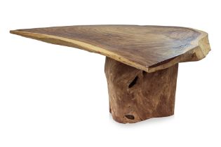 A FREE-FORM RAW TIMBER DINING TABLE