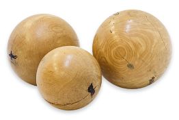 A GROUP OF THREE LARGE DECORATIVE WOODEN BALLS