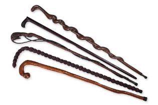 A GROUP OF FIVE ASSORTED WALKING STICKS