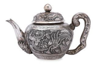 A DRAGON AND PHOENIX SILVER TEAPOT