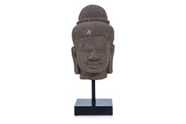 A CAMBODIAN KHMER CARVED STONE HEAD OF A DEITY