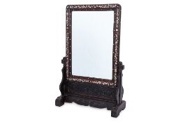 A BLACKWOOD AND MOTHER OF PEARL INLAID MIRROR ON STAND
