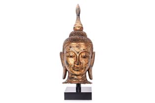 A LARGE BURMESE LACQUERED HEAD OF BUDDHA
