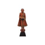 A BURMESE LACQUERED STANDING MONK FIGURE