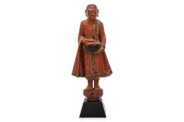 A BURMESE LACQUERED STANDING MONK FIGURE