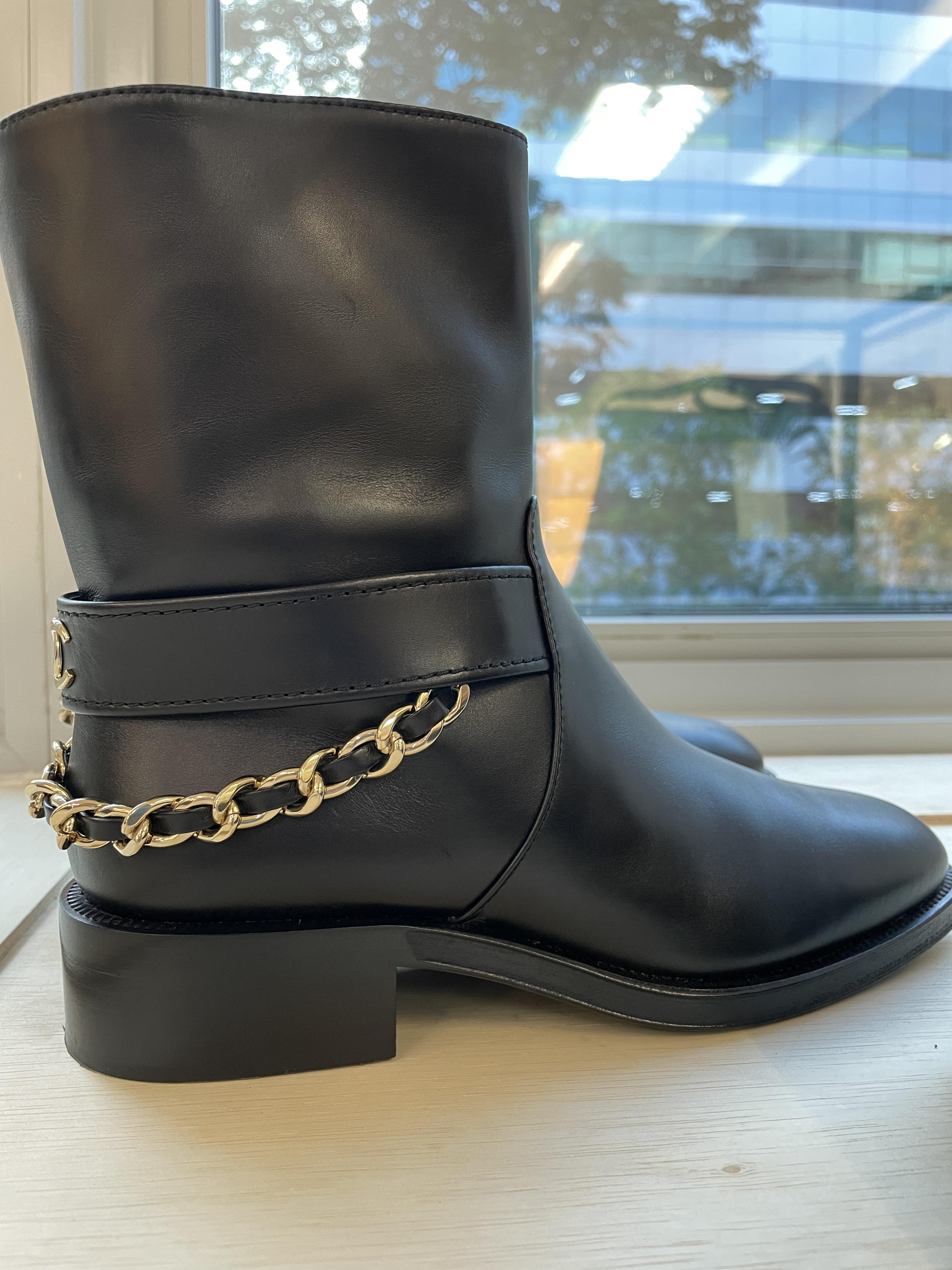 A PAIR OF CHANEL LEATHER ANKLE MOTO BOOTS - Image 5 of 12