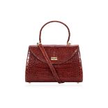 A BROWN CROCODILE SKIN TOP HANDLE BAG