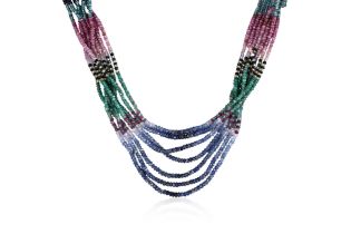 A MULTI STRAND RUBY, EMERALD AND SAPPHIRE BEAD NECKLACE
