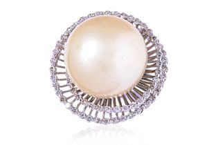 A LARGE CULTURED SOUTH SEA PEARL AND DIAMOND RING