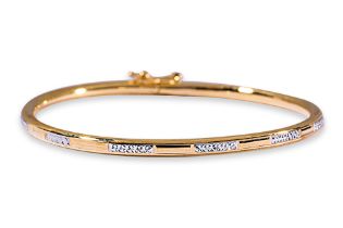 A HIGH CARAT GOLD CHILD'S BANGLE BY POH HENG