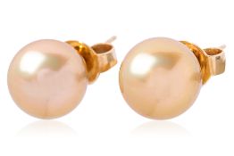 A PAIR OF GOLDEN CULTURED SOUTH SEA PEARL STUD EARRINGS
