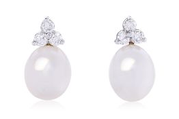A PAIR OF CULTURED SOUTH SEA PEARL AND DIAMOND STUD EARRINGS