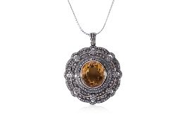 A CITRINE AND DIAMOND PENDANT ON CHAIN