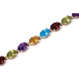 A MULTI-GEM SET GOLD BRACELET