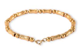 A HIGH CARAT 'BAMBOO AND BEADS' GOLD BRACELET