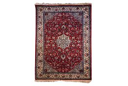 A PERSIAN STYLE WOOL RUG