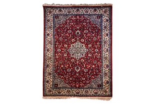 A PERSIAN STYLE WOOL RUG