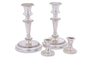 TWO PAIRS OF SILVER AND SILVER PLATED CANDLESTICKS