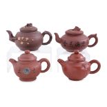 A GROUP OF FOUR YIXING POTTERY TEAPOTS