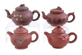 A GROUP OF FOUR YIXING POTTERY TEAPOTS