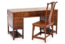 A CHINESE ELM TWIN PEDESTAL DESK AND CHAIR