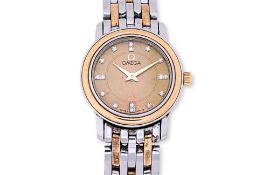 AN OMEGA LADIES STAINLESS STEEL AND GOLD BRACELET WATCH