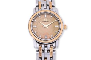 AN OMEGA LADIES STAINLESS STEEL AND GOLD BRACELET WATCH
