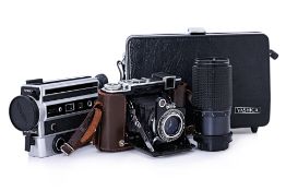 A ZEISS IKON FOLD-OUT CAMERA, A TOKINA LENS AND A SUPER 8