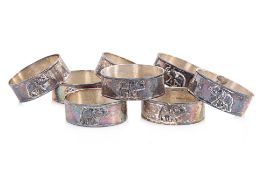 A SET OF EIGHT ELEPHANT DECORATED SILVER NAPKIN RINGS