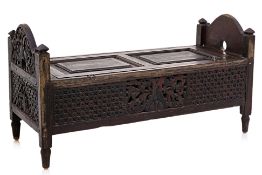 AN INDIAN BENCH SEAT WITH CHEST BELOW