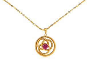 A GOLD PENDANT ON CHAIN