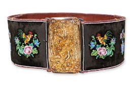 A LARGE BEADED BELT WITH SILVER-GILT BUCKLE