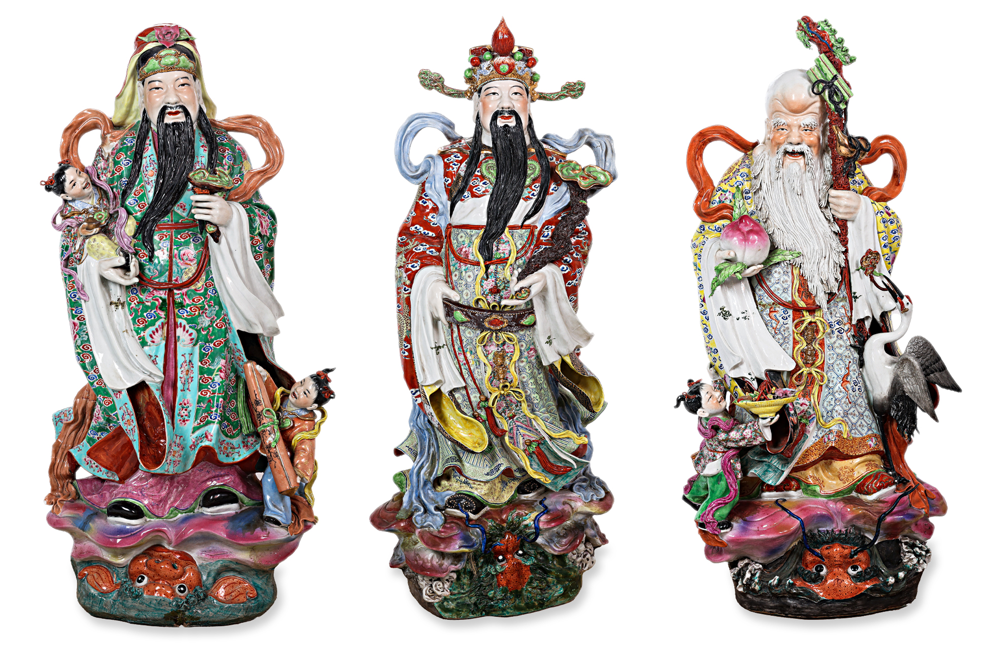 A VERY LARGE SET OF THREE FU, LU SHOU PORCELAIN FIGURES