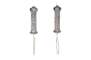 A PAIR OF SILVER BRIDAL CURTAIN HOOKS