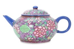 AN ENAMELLED YIXING PEONY AND BUTTERFLY TEAPOT