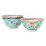 A SET OF THREE FAMILLE ROSE TURQUOISE GROUND PEONY BOWLS