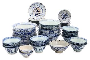 AN ASSORTMENT OF BLUE AND WHITE BOWLS AND SAUCERS