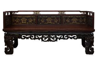 A CARVED AND PARCEL GILT WOOD BENCH