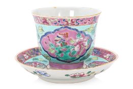A TURQUOISE GROUND FAMILLE ROSE TEACUP & SAUCER