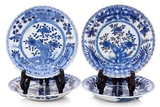 A GROUP OF FOUR BLUE AND WHITE SAUCERS