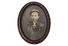 A PERANAKAN PHOTOGRAPHIC PORTRAIT OF A LADY