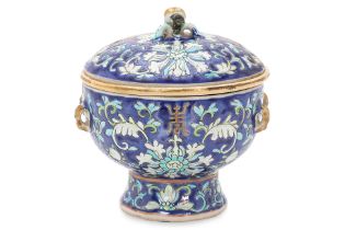 A BLUE GROUND FAMILLE ROSE VESSEL WITH LID AND LINER