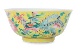 A YELLOW GROUND FAMILLE ROSE PHOENIX AND PEONY BOWL