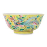 A YELLOW GROUND FAMILLE ROSE PHOENIX AND PEONY BOWL