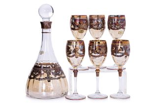 AN ITALIAN GILT DECORATED DECANTER AND WINE GLASS SET