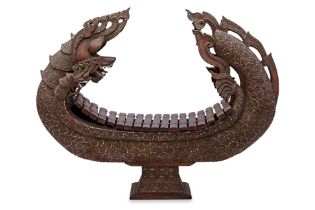 A LARGE BURMESE NAGA SHAPED CARVED WOOD XYLOPHONE