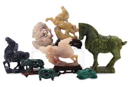 A GROUP OF CARVED STONE ANIMALS