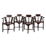 A SET OF 4 CARVED HARDWOOD CORNER CHAIRS