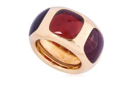 A THREE STONE GARNET 'BISANZIO' RING BY POMELLATO